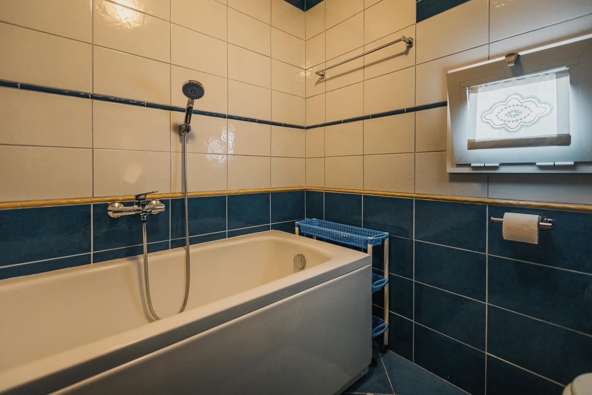 Upstairs bathroom with bathtub